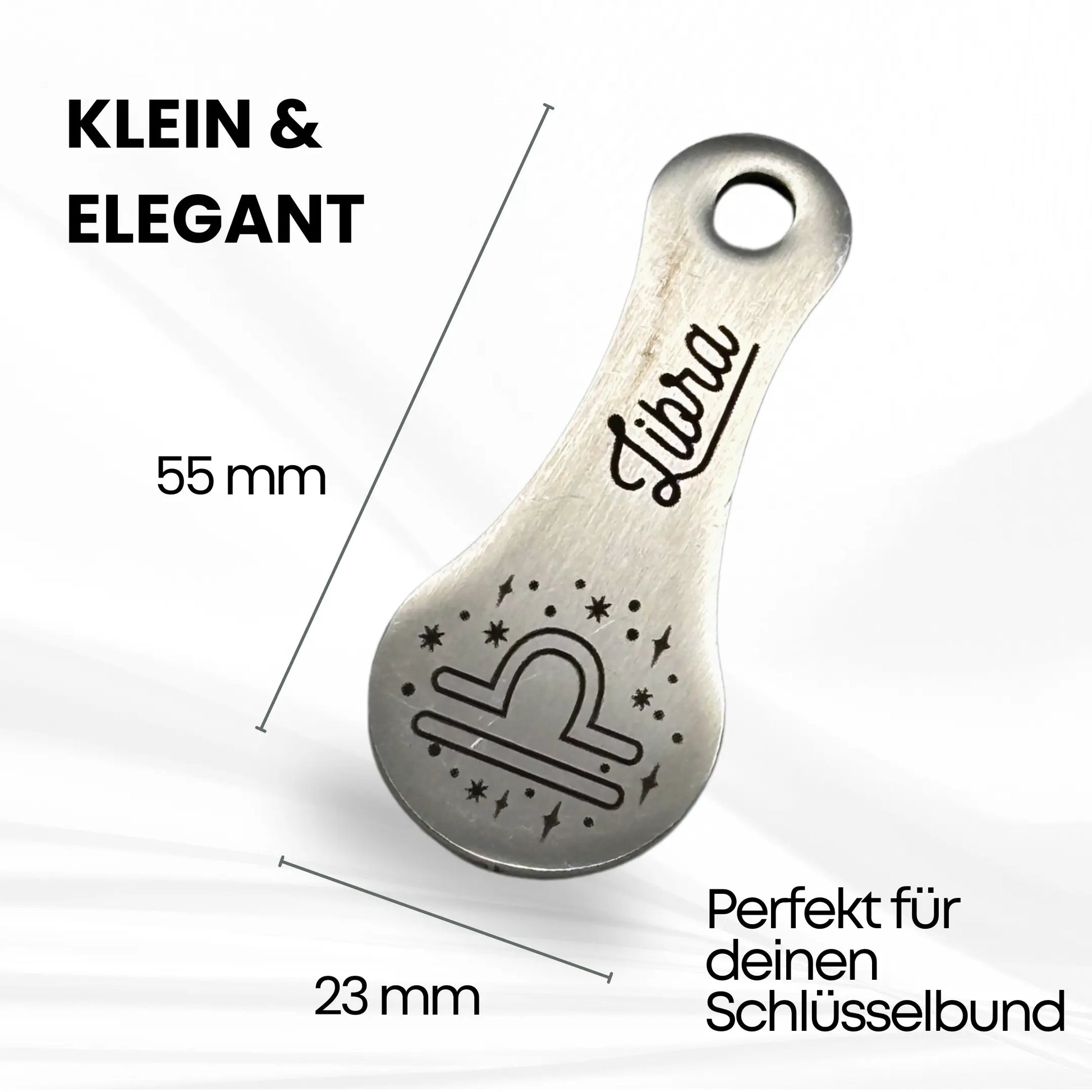 Eleganter Libra Einkaufswagenlöser aus Edelstahl – kompakte Größe (55 x 23 mm), ideal für den Schlüsselbund und mit edlem Waage-Symbol graviert.